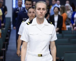 Photo of new Navy lieutenant during CUSOM commissioning ceremony.