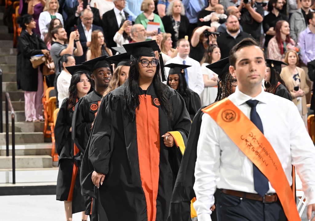CUSOM graduates walk in ceremony
