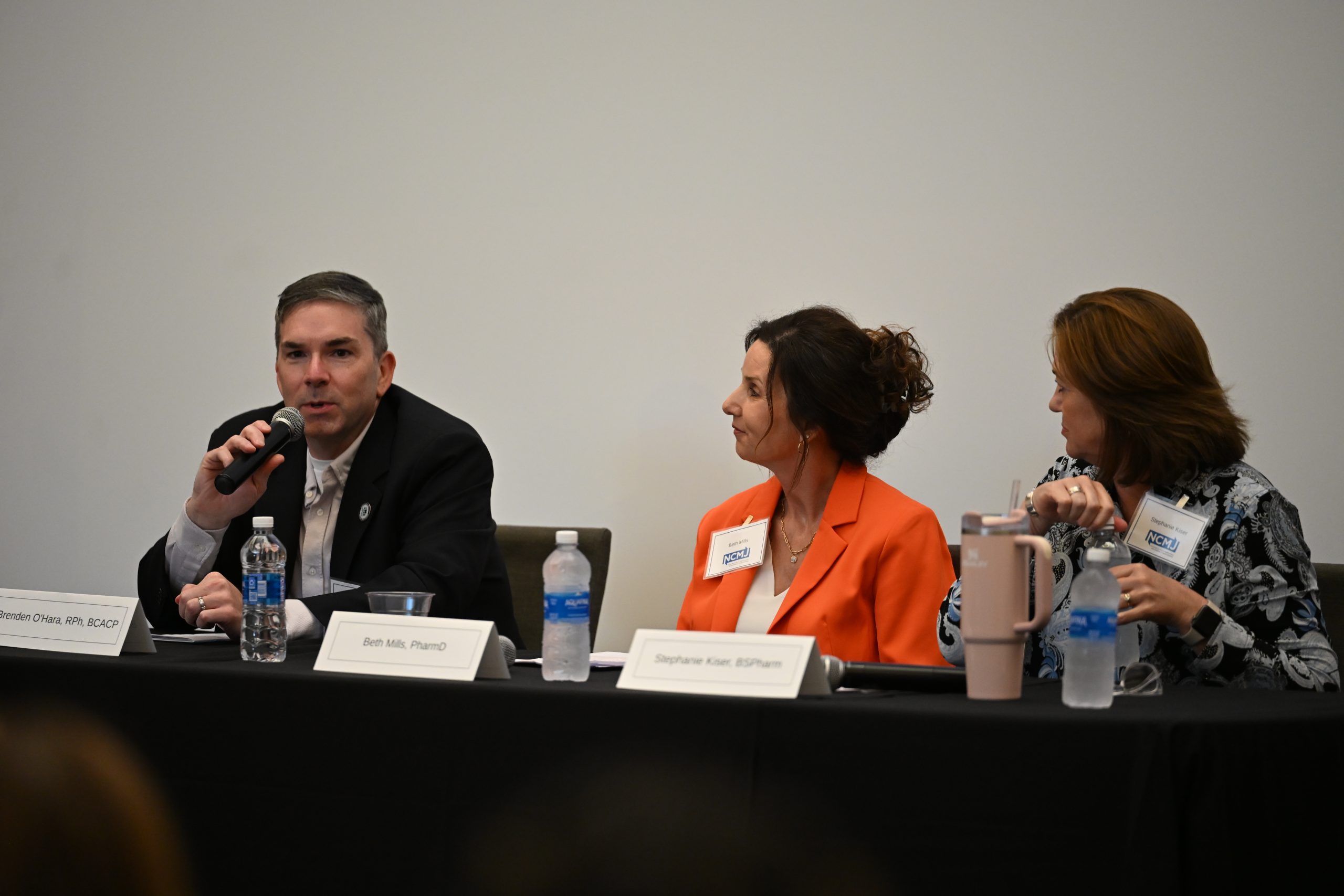A male panelist and two female panelists
