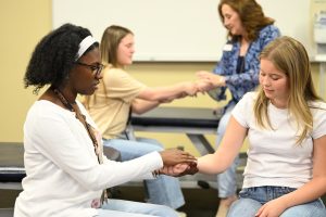 Students practice hands on OMM