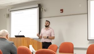 Student presenting at podium