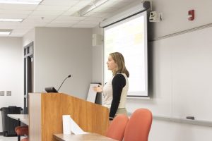 Student presenting at podium