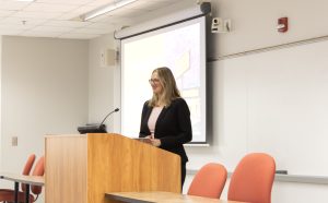 Student presenting at podium