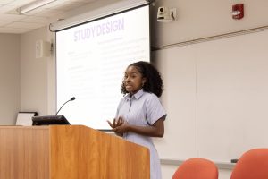 Student presenting at podium