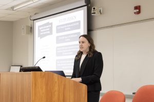 Student presenting at podium