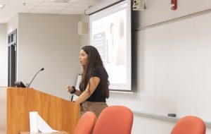 Student presenting at podium