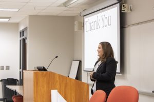 Student presenting at podium
