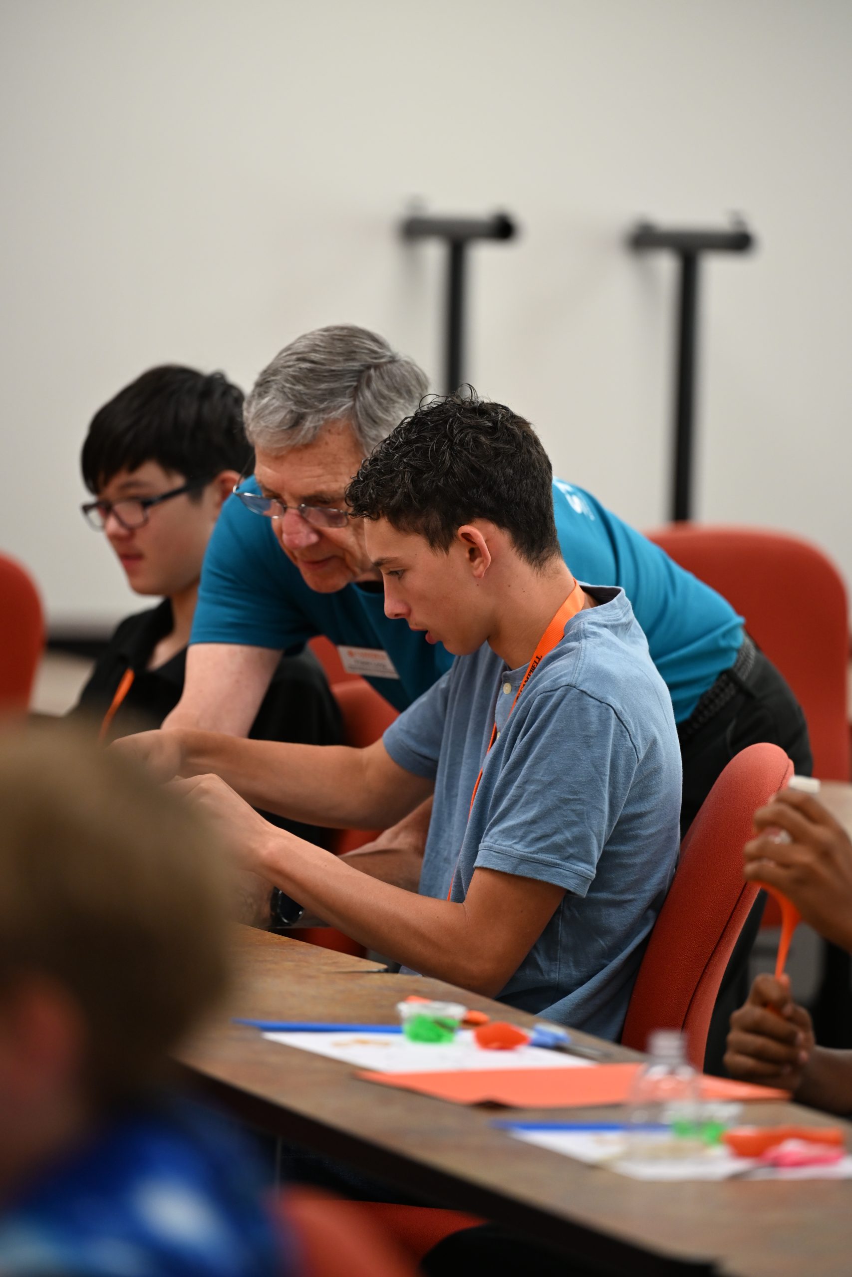 Campbell University faculty member works one-on-one with a middle school STEM Camp participant during a classroom activity.