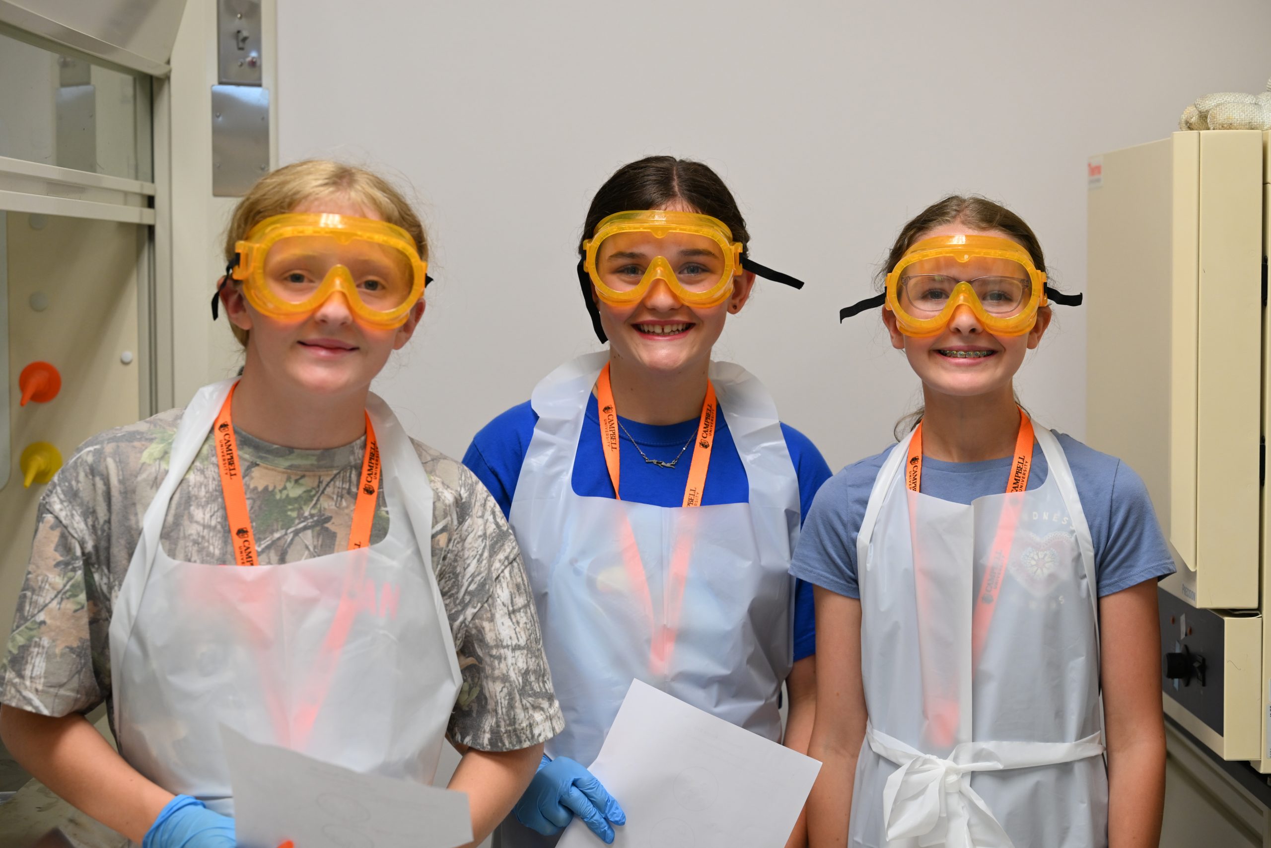 Three female students wearing PPE
