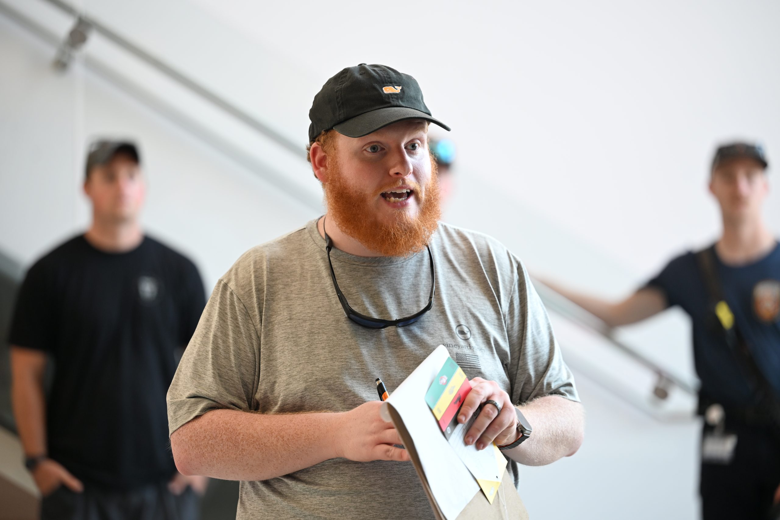 Male alumnus giving instructions to a group prior to a rotation