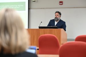 Student presenting at podium
