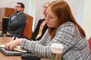 Faculty taking notes