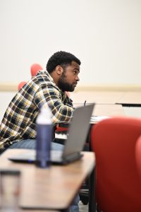 Student listing to presentation