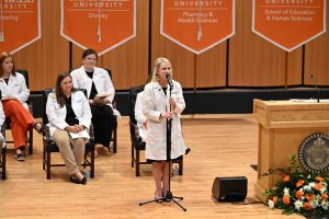 Alumna Jennifer Holly sings during the ceremony