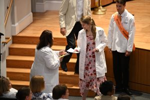 Student receives a note from an alumnus, family member or friend as they walk off stage