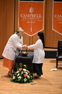Student receiving blessing of the hands