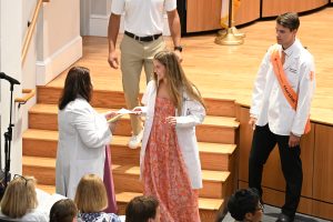 Student receives a note from an alumnus, family member or friend as they walk off stage