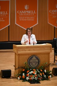 Dr. Laura Gerstner speaking at podium