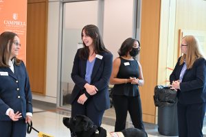 Group of four students chatting in the lunch line