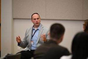A presenter speaks to students during a professional development workshop focused on career preparation and healthcare education.
