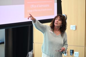A member of the Office of Admissions presents information about academic programs and the admissions process to prospective students.