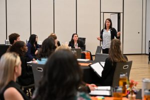 A speaker leads a discussion with students during a professional development session at Campbell University's College of Pharmacy & Health Sciences.