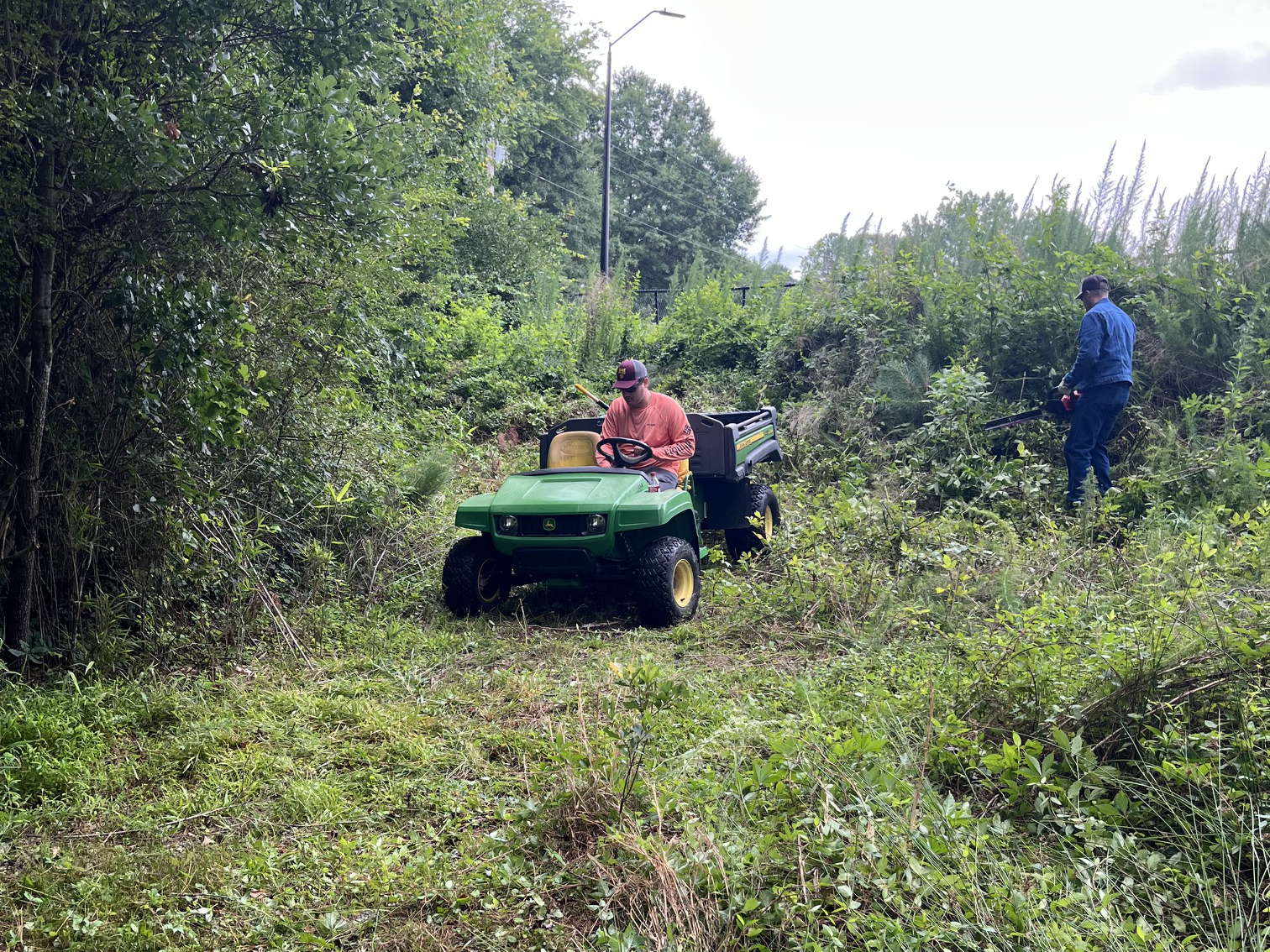 Man on a tractor working on walking trails