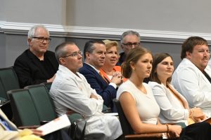 President and First Lady Downs sitting with honored guests