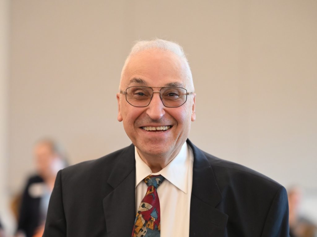 Man in business suit a tie smiling
