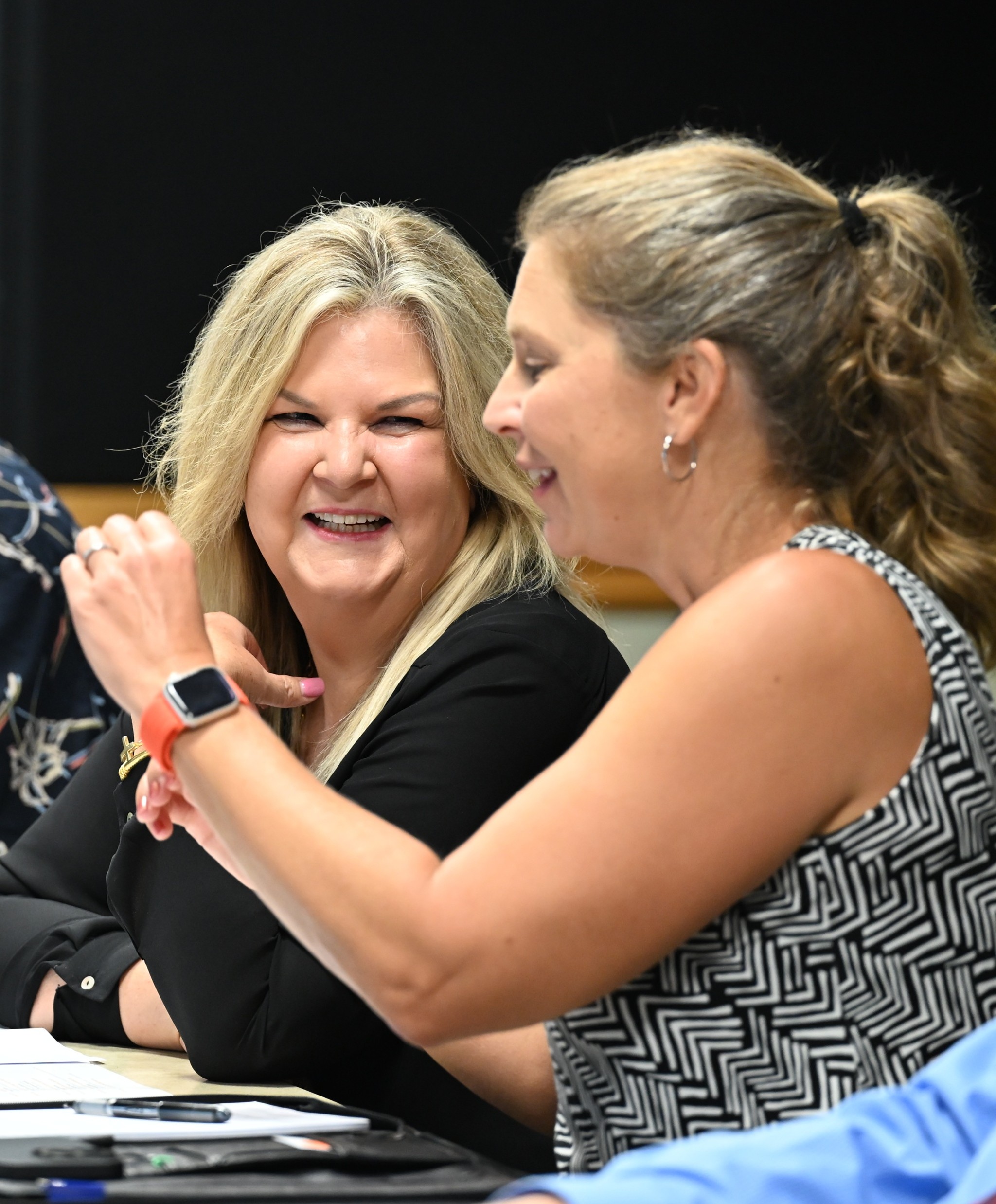 Dr. Connie Barnes laughing with a colleague during a University event
