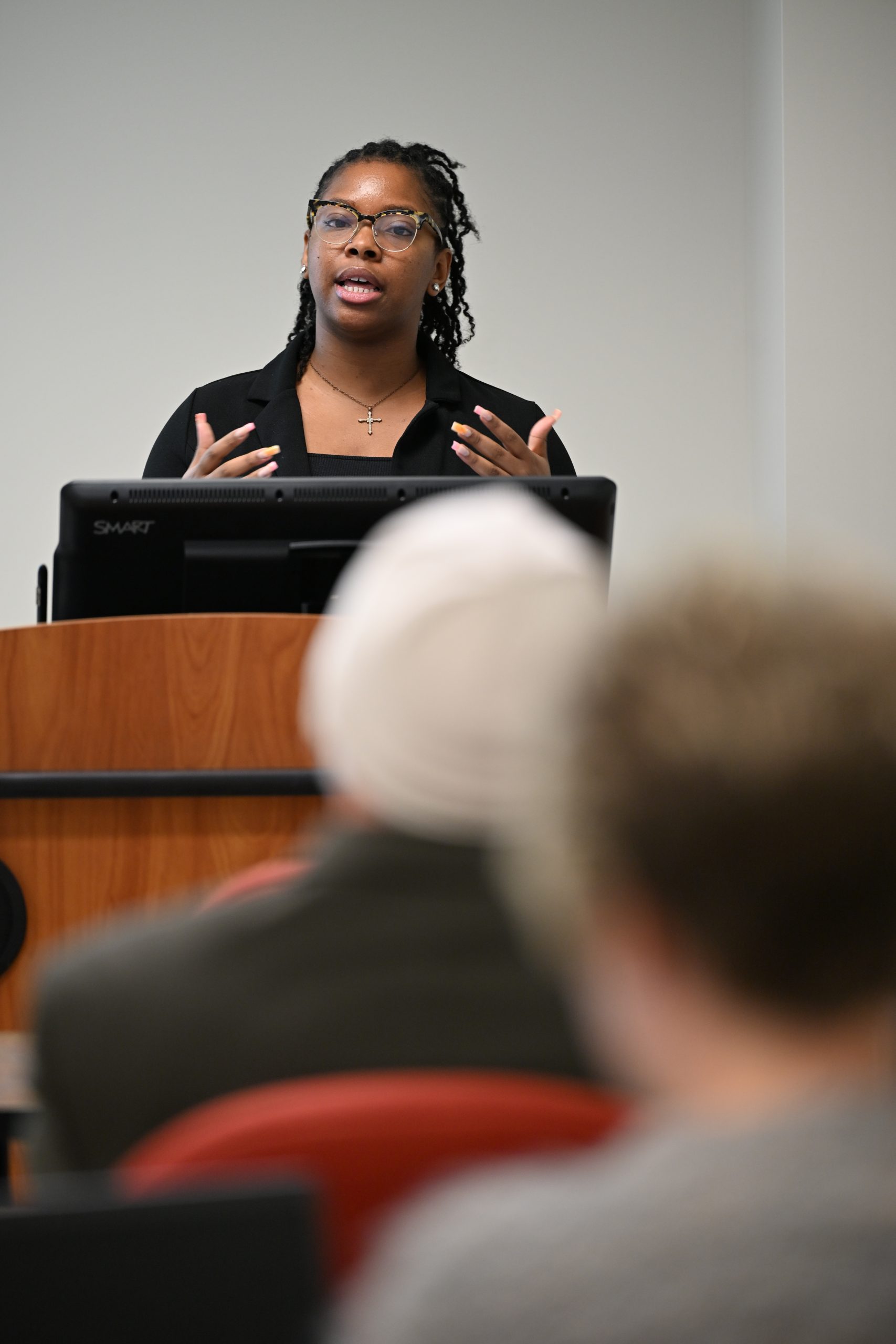 student presenting at podium