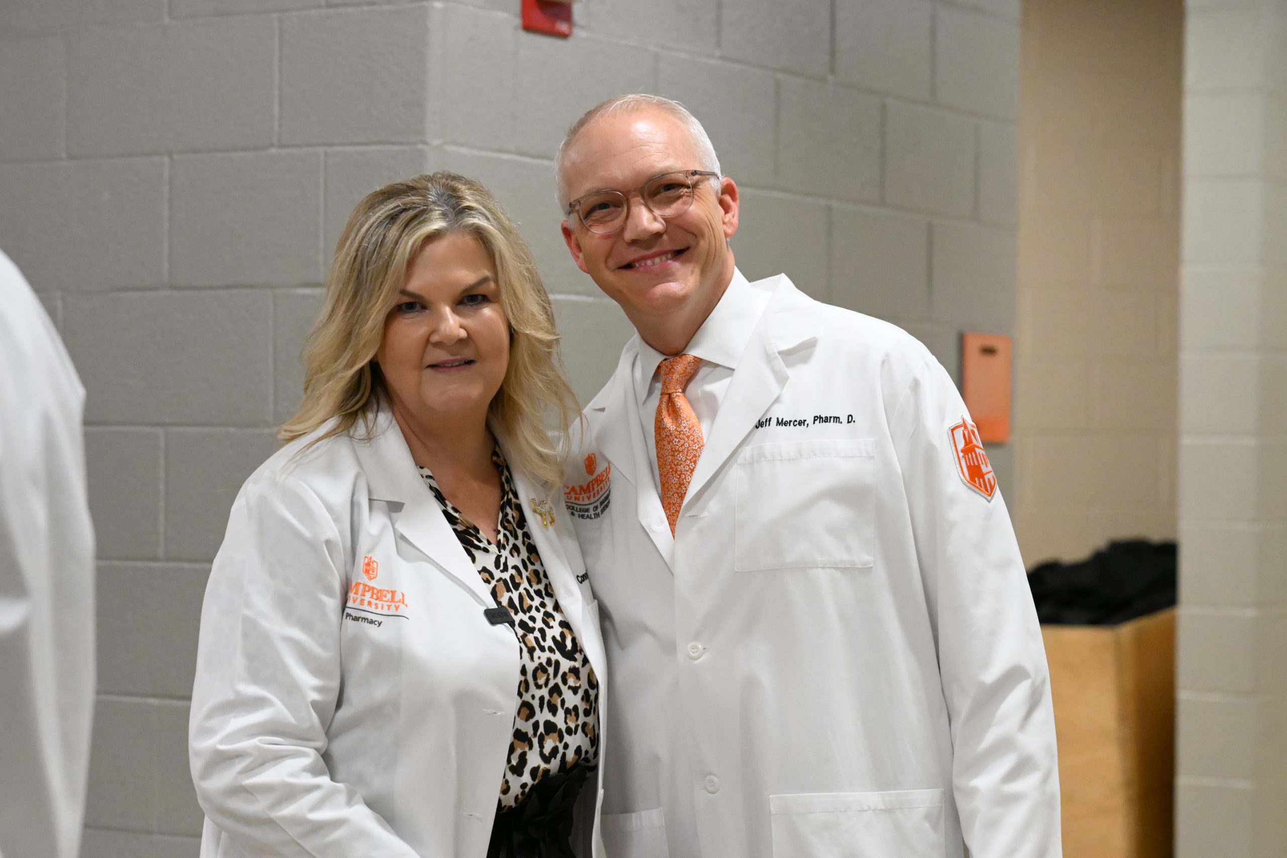 Dr. Connie Barnes and Dr. Jeff Mercer stand together before the ceremony