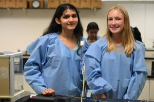 Two students smiling for the camera