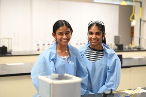 Two students with big smiles