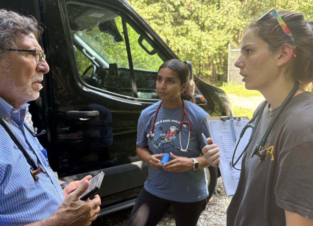 Preparing to treat a patient in the woods.