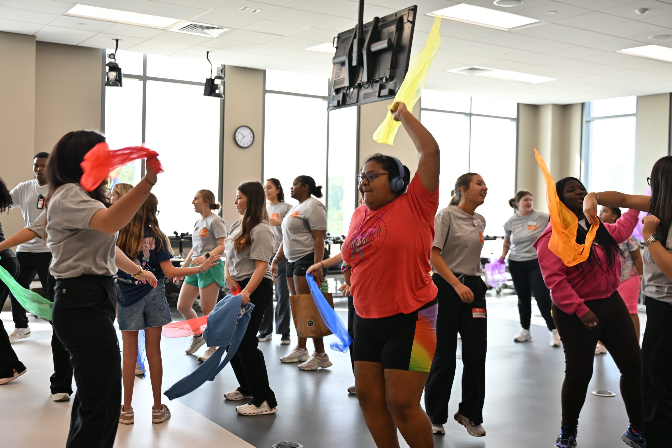 Students and special Olympics athletes dancing for exercise. 