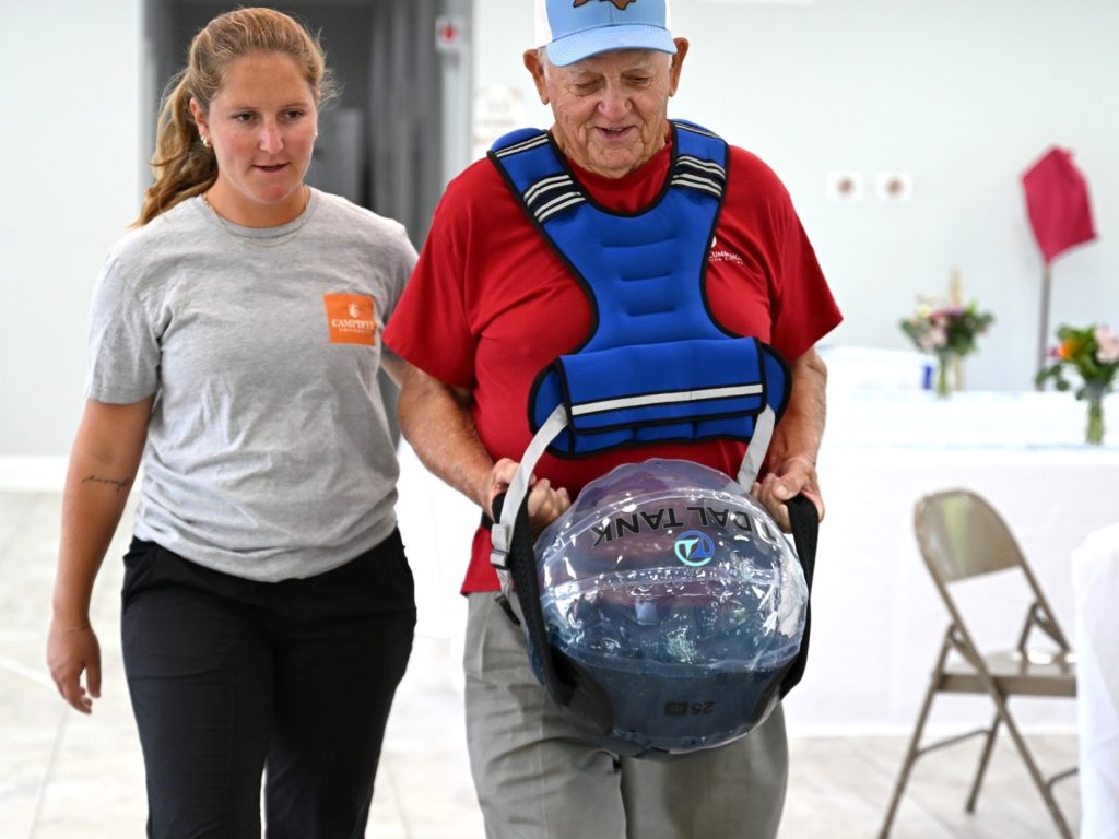 Student walking with senior