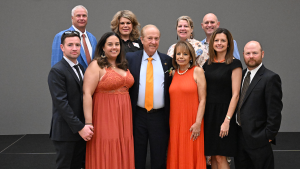 Distinguished Alumnus W. Brooks Matthews poses for a photo alongside his wife, family and friends