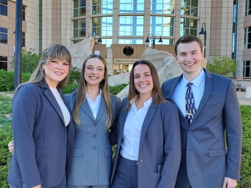 Photo of four Campbell Law advocates Whitney Peck ‘27, Hunter Walker ‘27, Caroline Shabet ‘27 and Mikenna Morrison ‘27 posing outside Denver Strum College of Law
