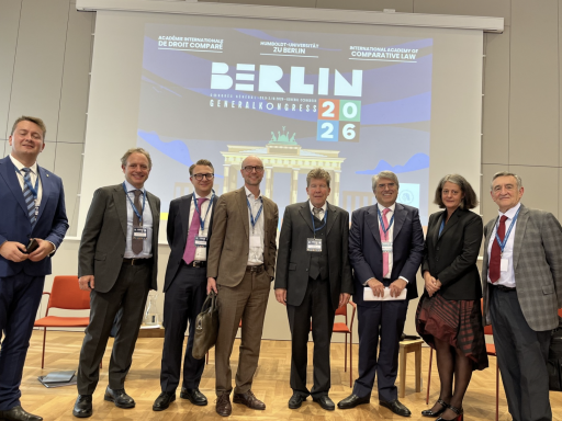 Photo of a panel of 11 people including Campbell Law Professor Raluca Papadima in front a screen that says Berlin