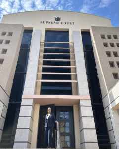 Photo of Tracy Harris '26 posing in front of the Namibia Supreme Court