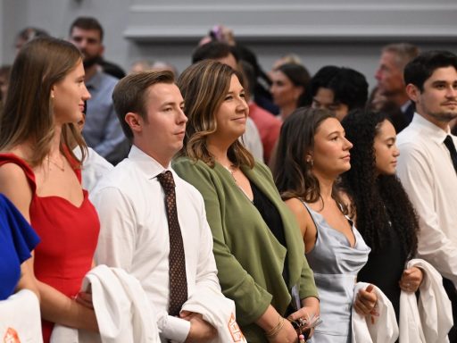 Med school students wait to wear their white coats.