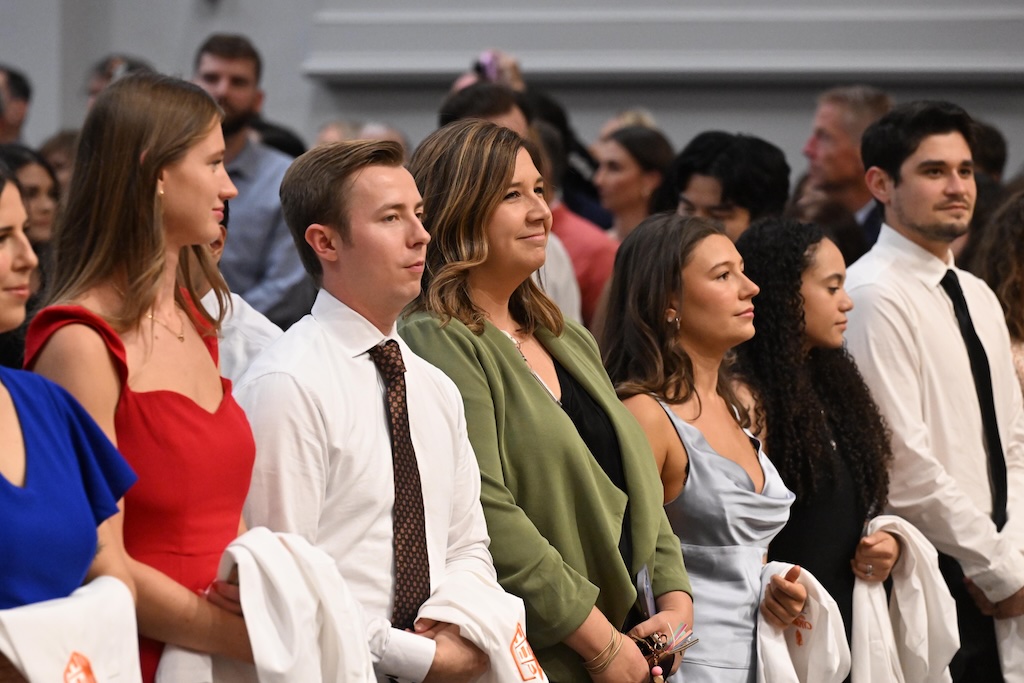 Med school students wait to wear their white coats.
