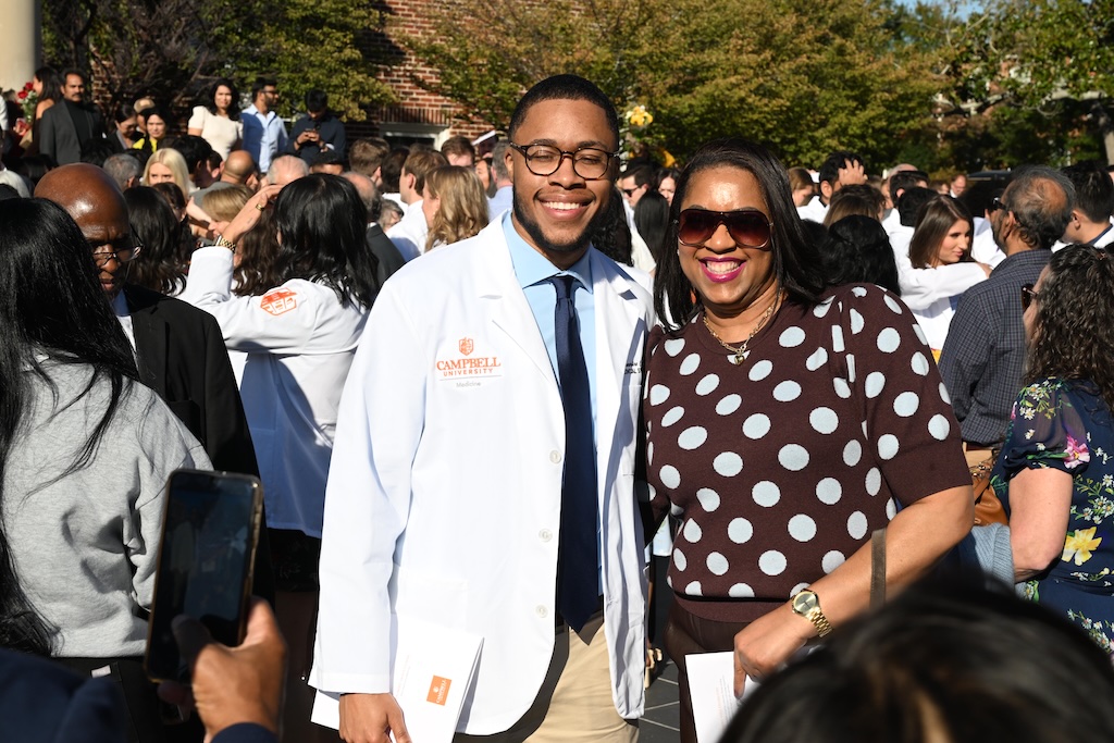 Students pose for a photo after CUSOM white coat ceremony