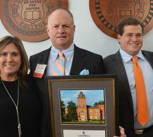 Beth '92, Jerry and Jeremy '16 Milton pose for a photo.