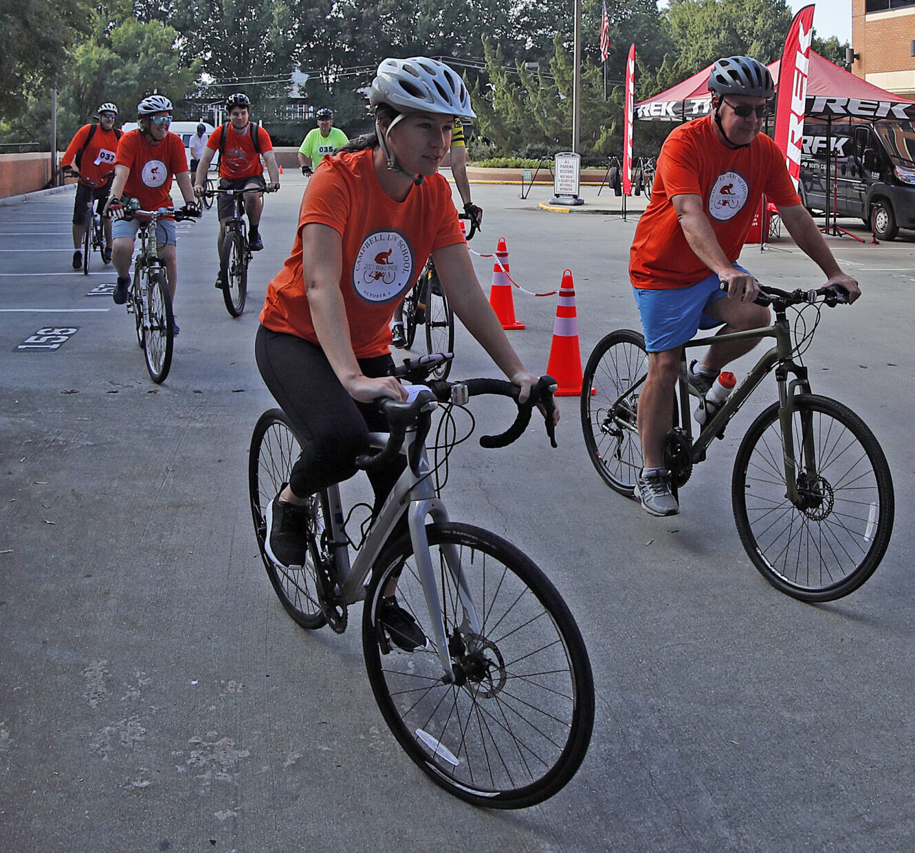 Photo of bike riders leaving Campbell Law parking lot