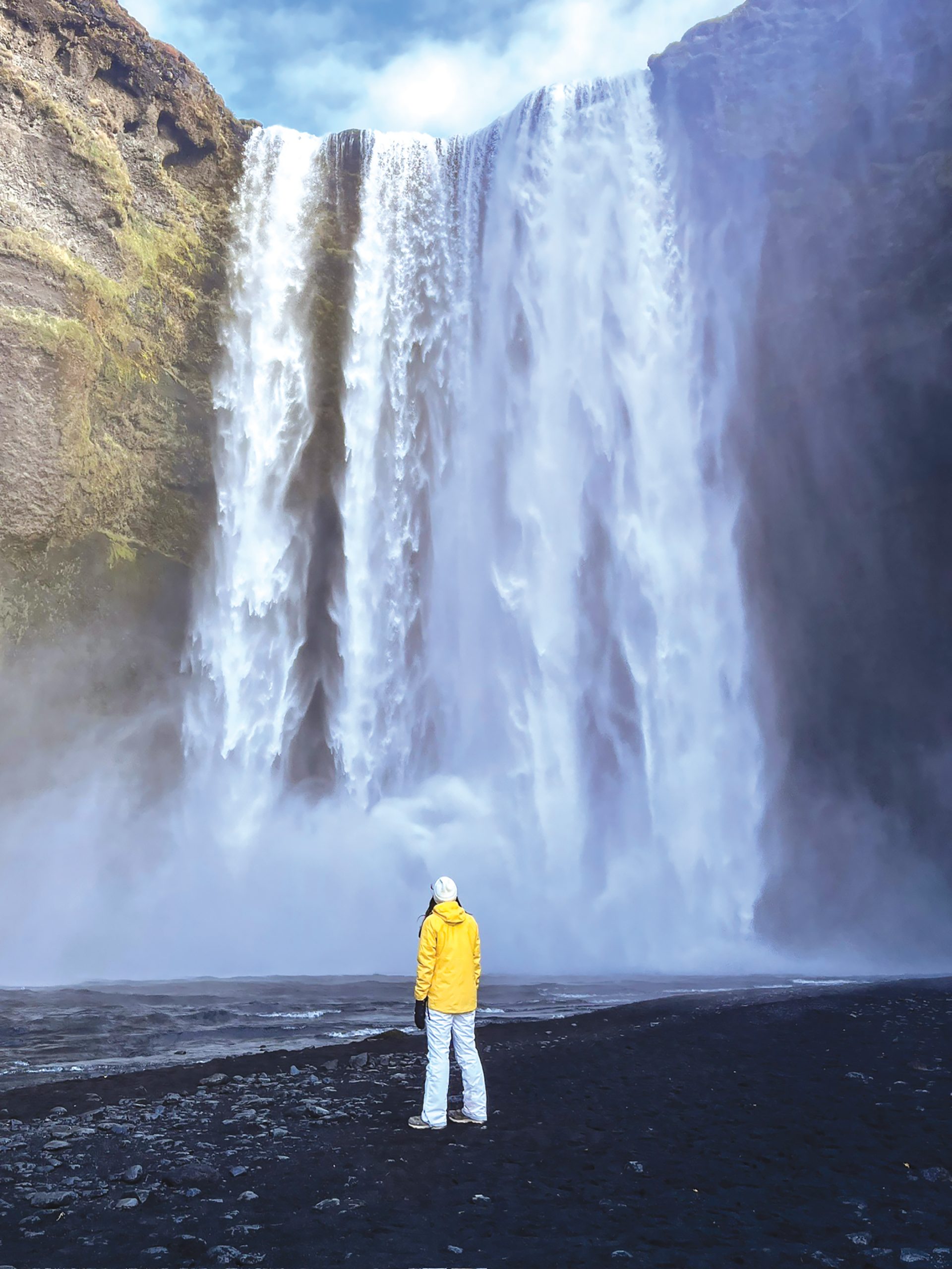 Lexie Weidner stares at a giant waterfall