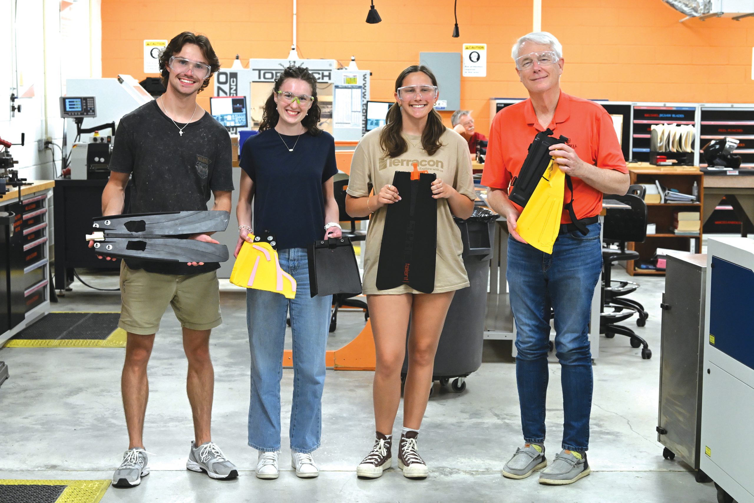 Engineering students show off latest design of prosthetic swim fins.