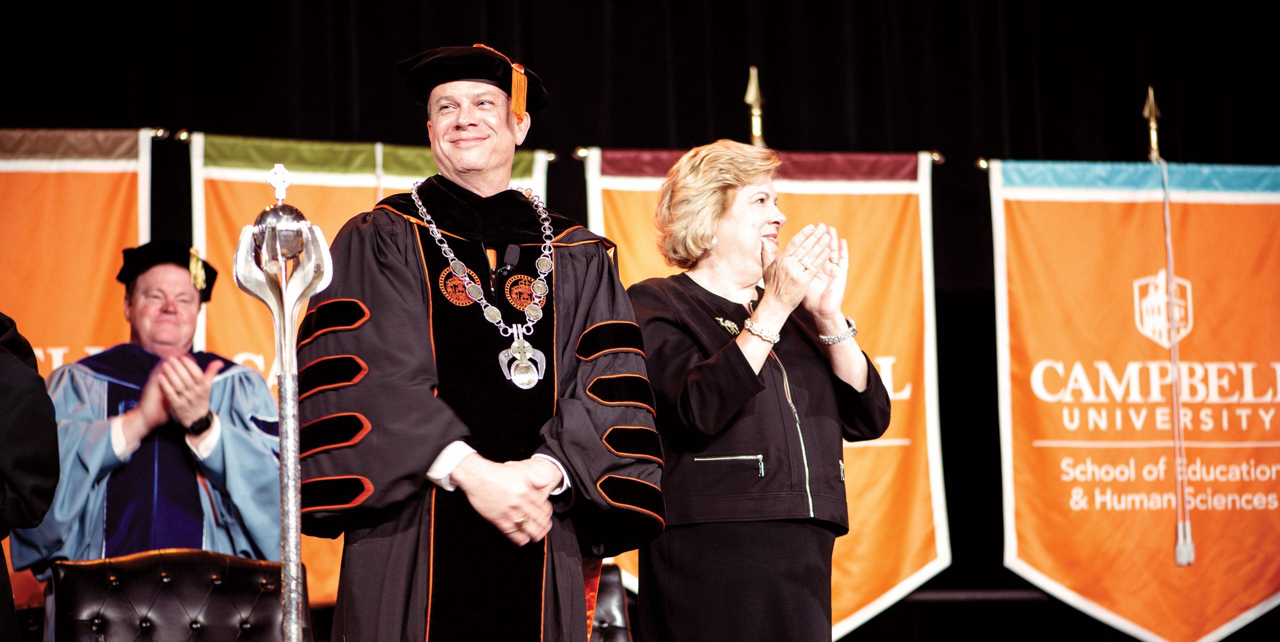 President William M. Downs and First Lady Kimberly Downs address the crowd at his investiture ceremony in March.