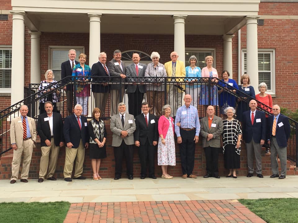 The Class of 1969 attendees pose for a group photo outside of Marshbanks Dining Hall.